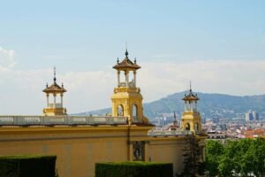 Captivating cityscape of Barcelona with historic architecture and distant mountains.